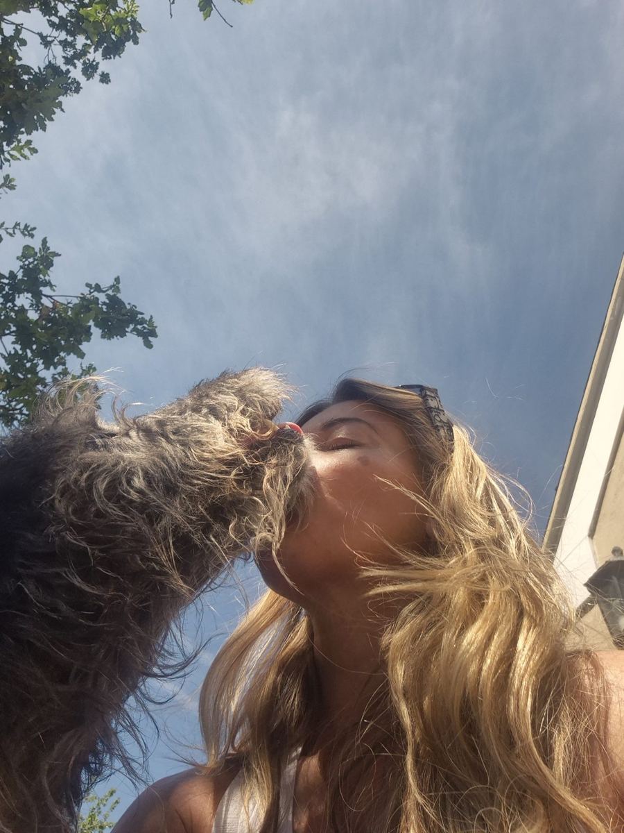 Angie with one of the dogs she walks